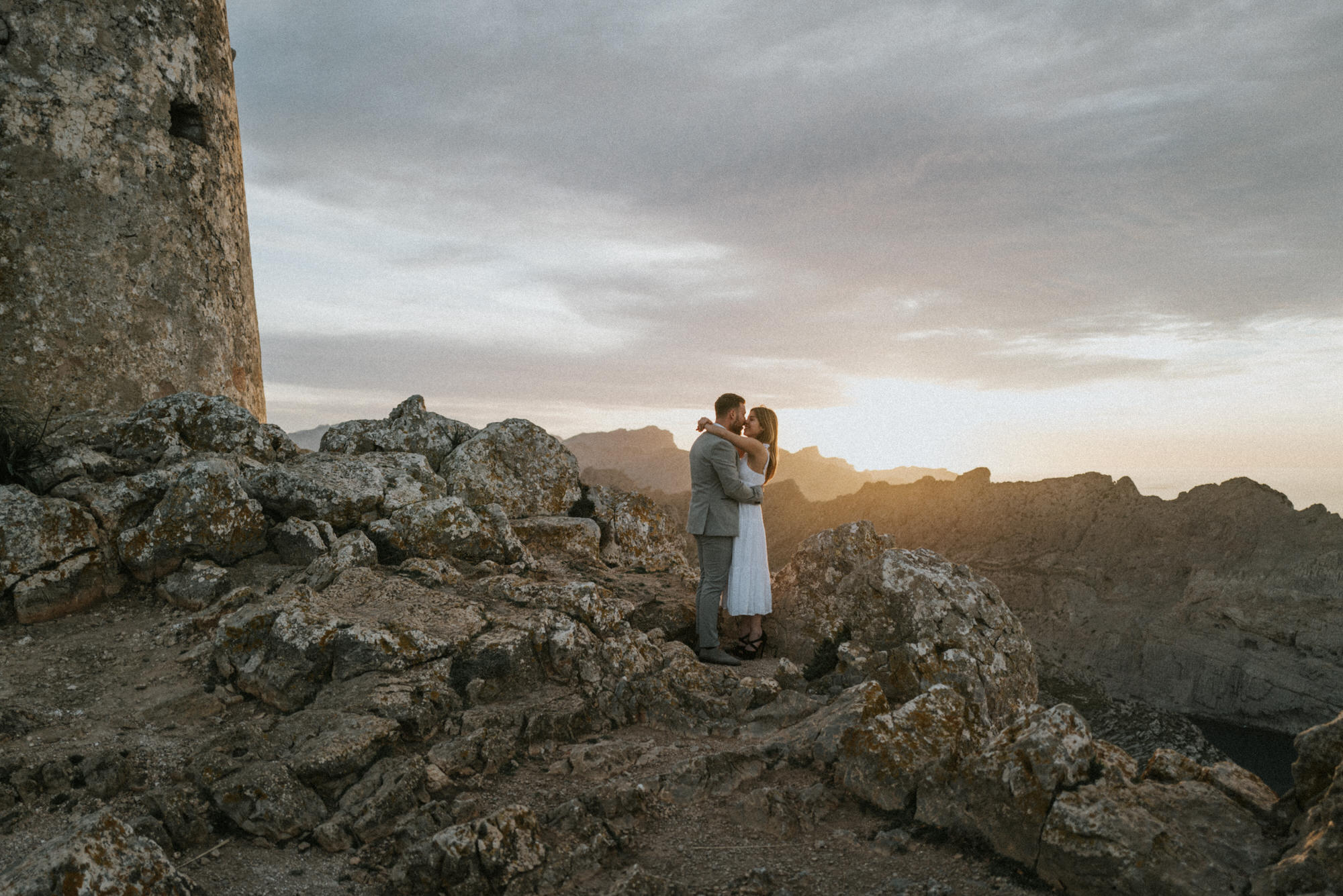 Wedding couple at the Mallorcan coast at sunset